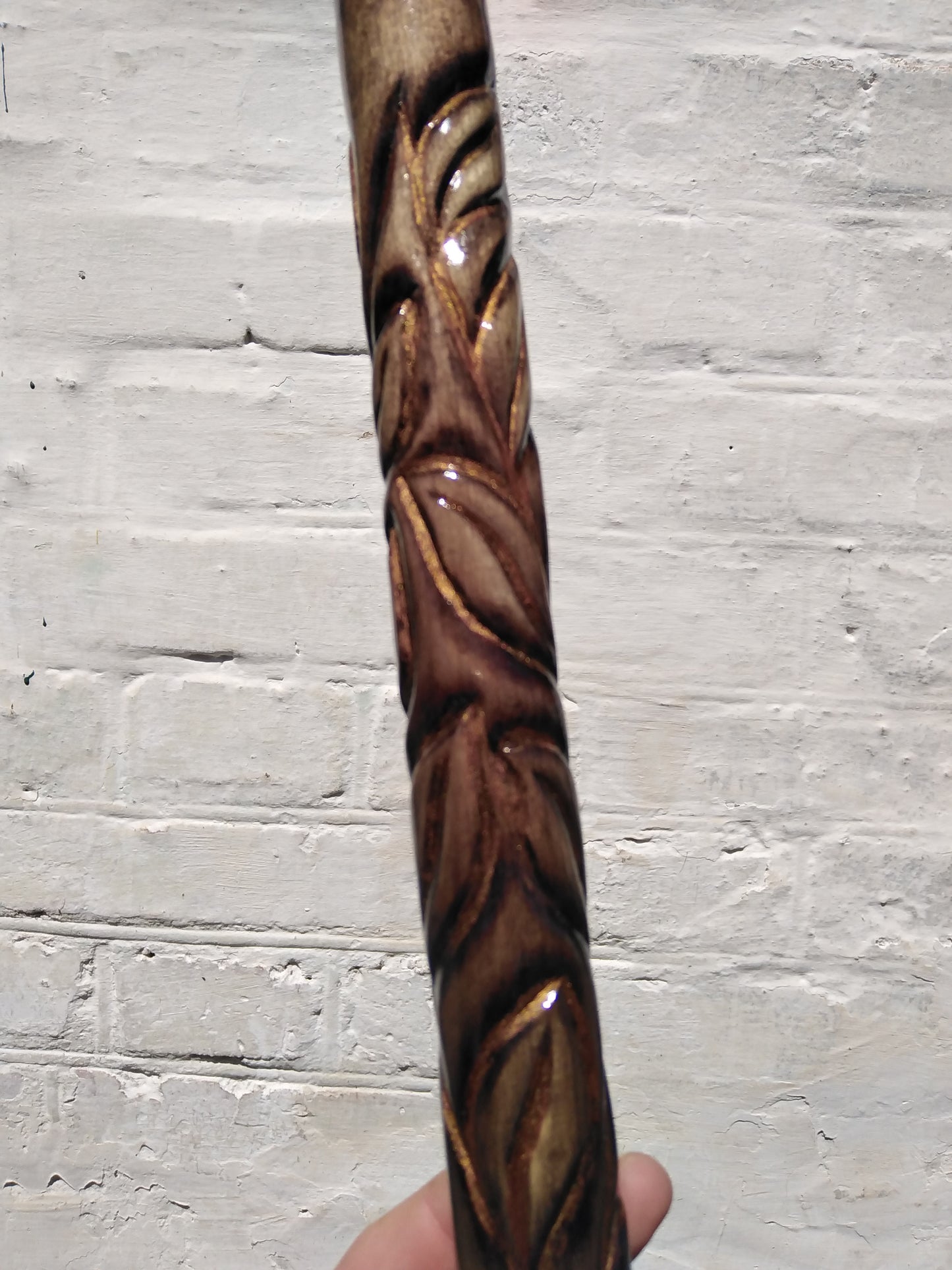 Carved wooden cane with a handle in the form of a flower