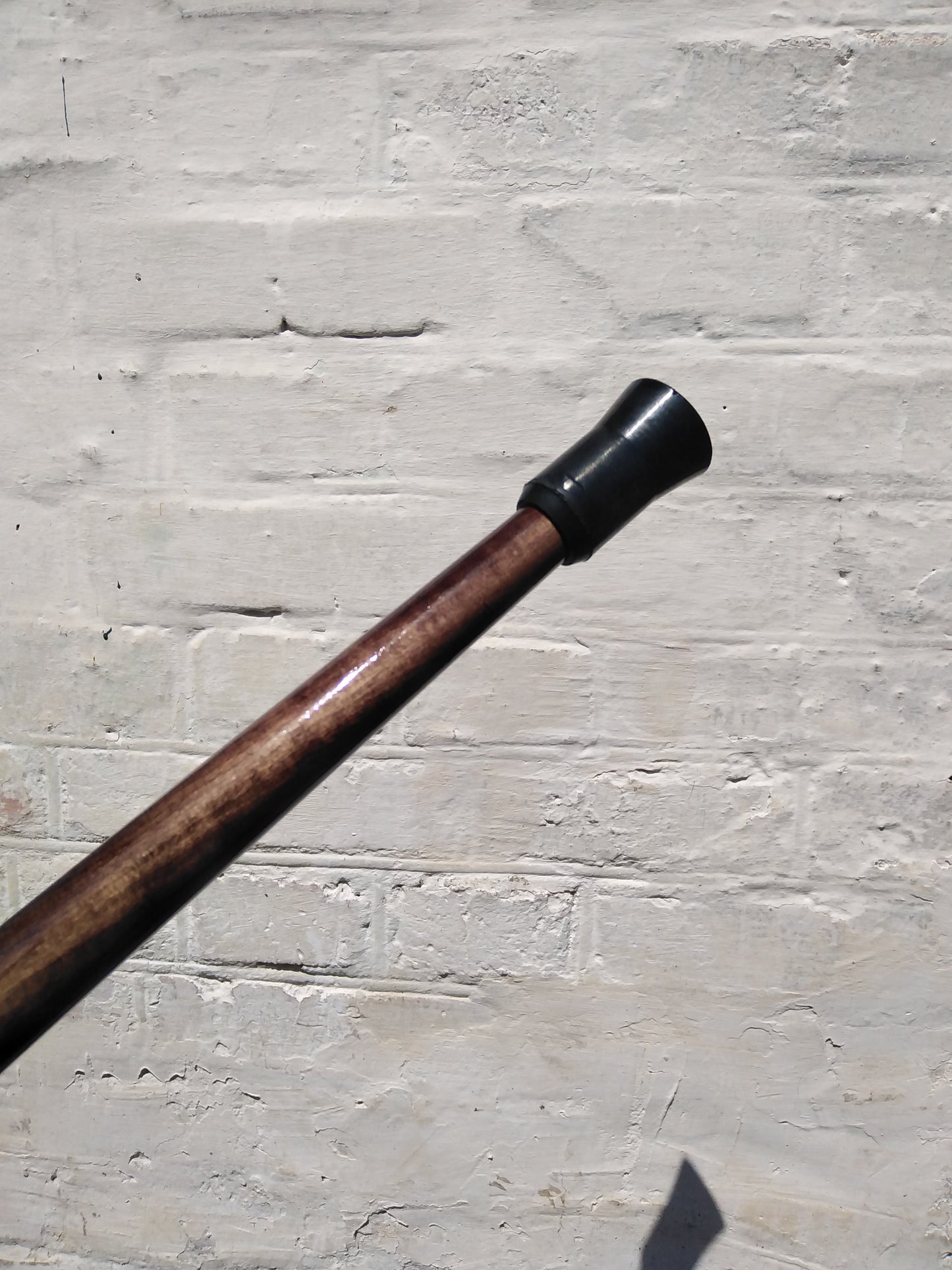 Carved wooden cane with a handle in the form of a flower