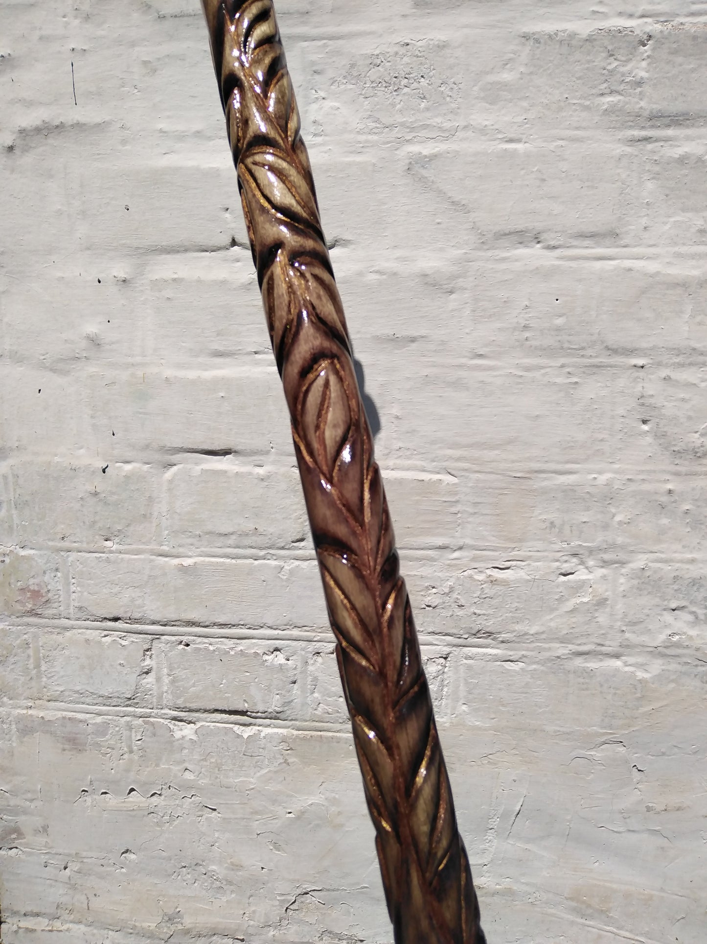 Carved wooden cane with a handle in the form of a flower