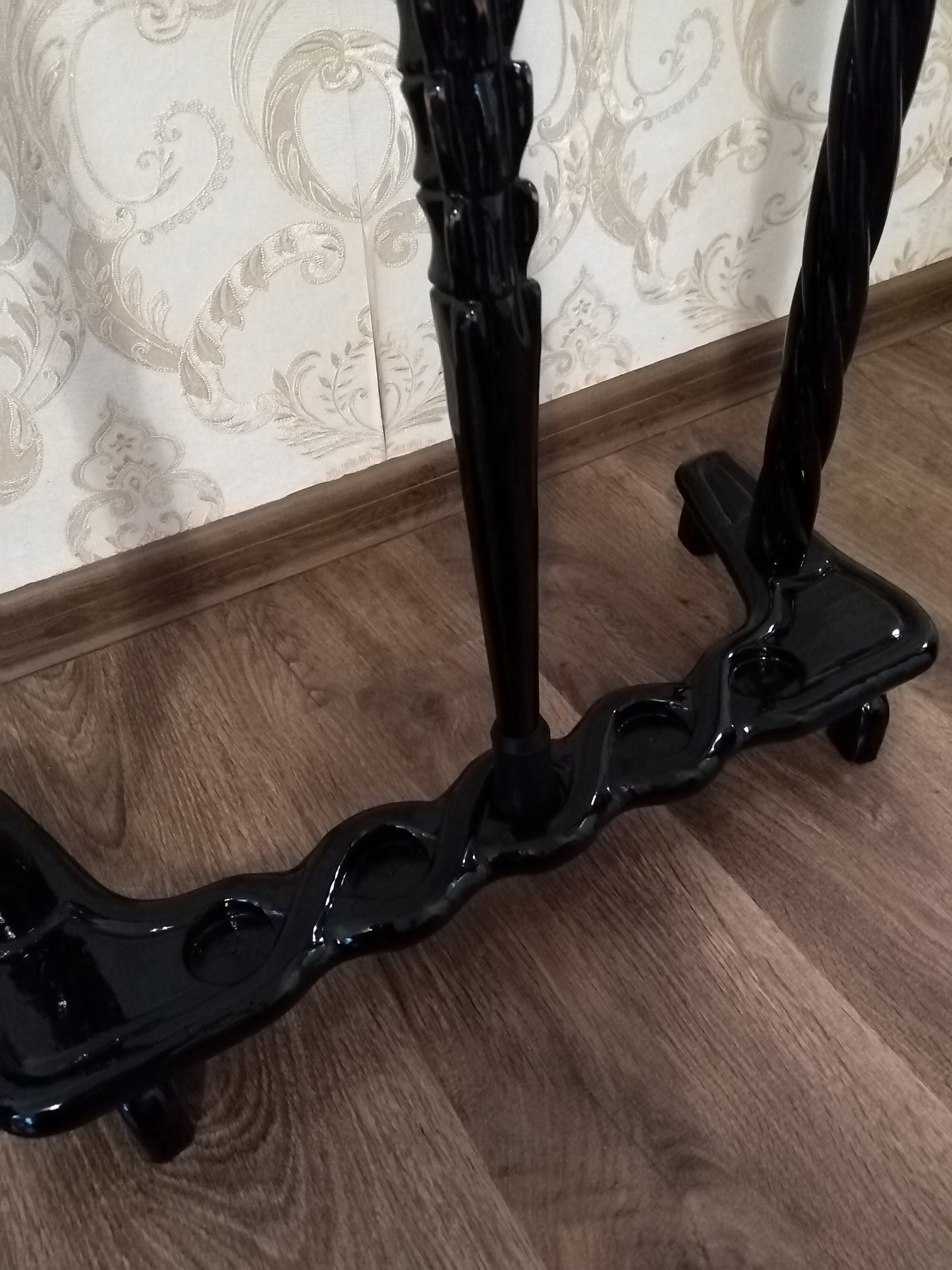 Carved wooden stand for canes