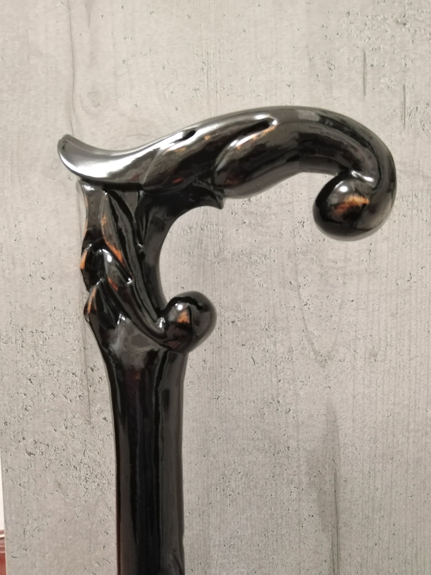 A carved wooden cane in the baroque style
