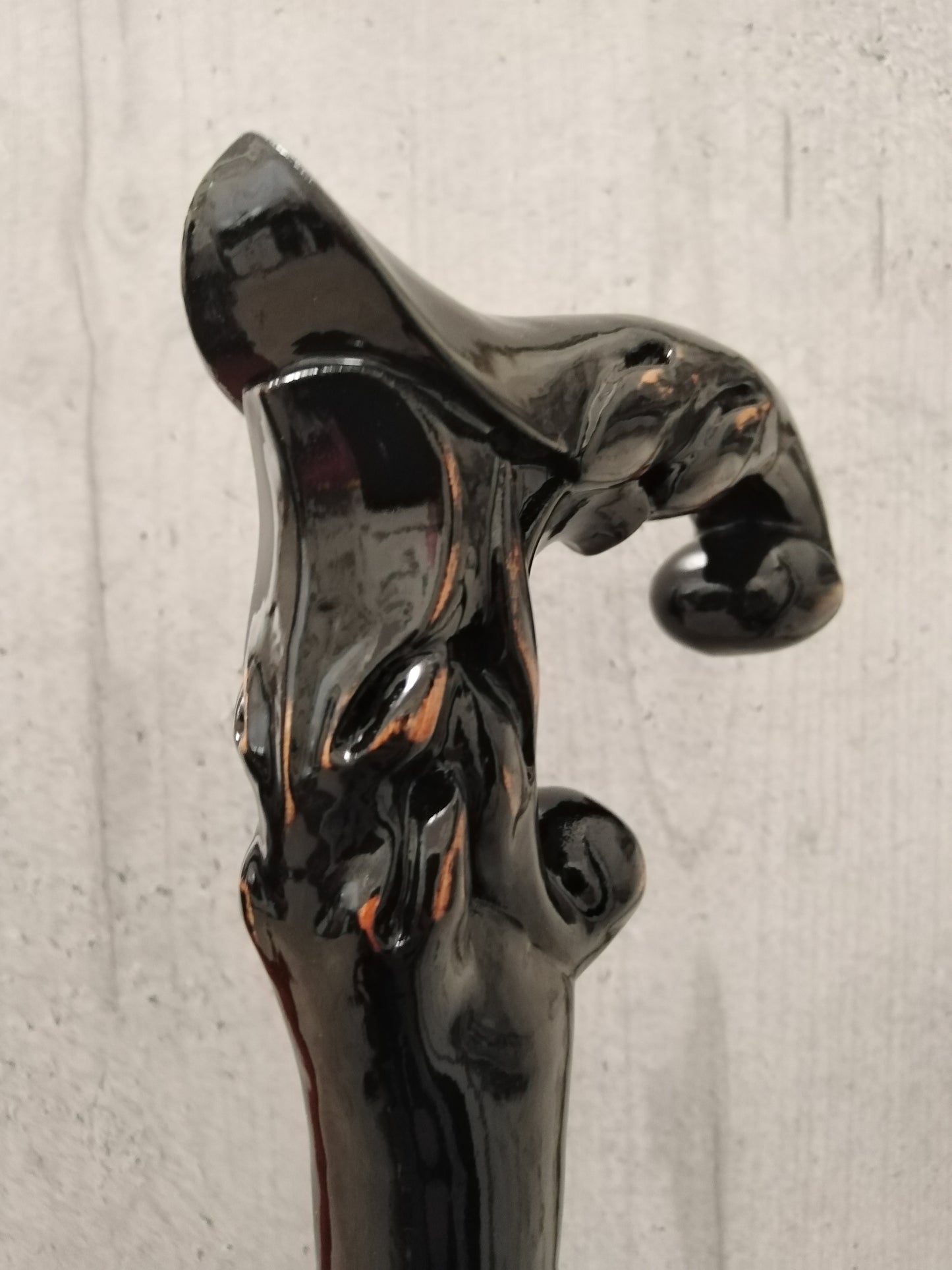 A carved wooden cane in the baroque style