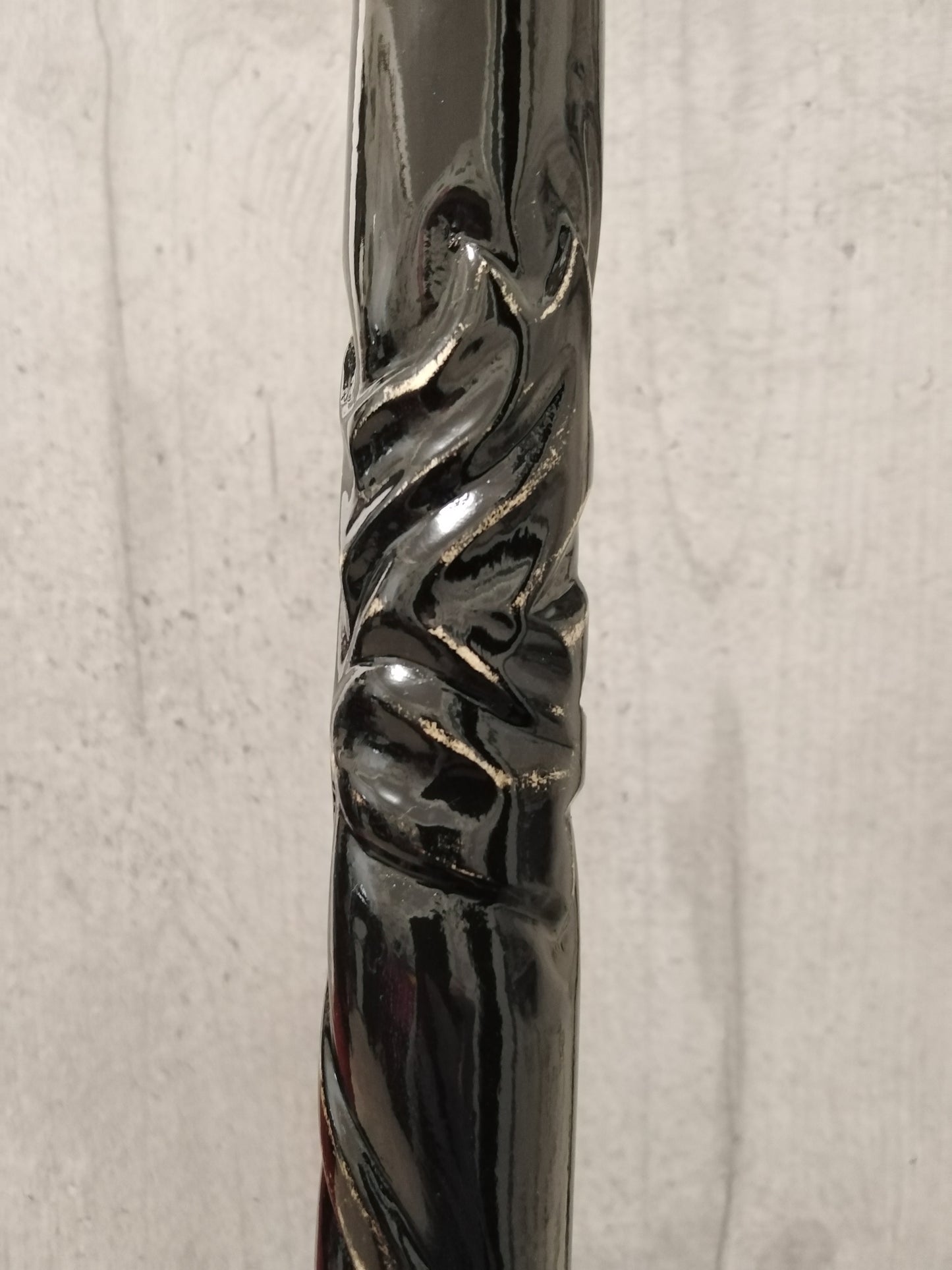 A carved wooden cane in the baroque style