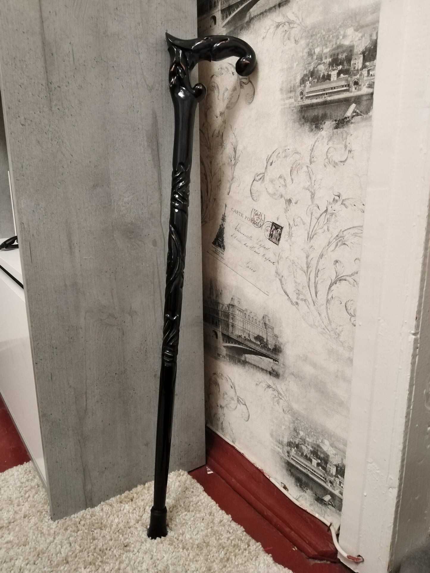 A carved wooden cane in the baroque style
