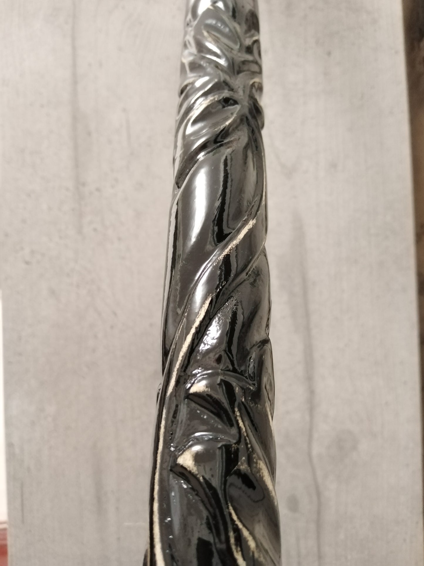 A carved wooden cane in the baroque style