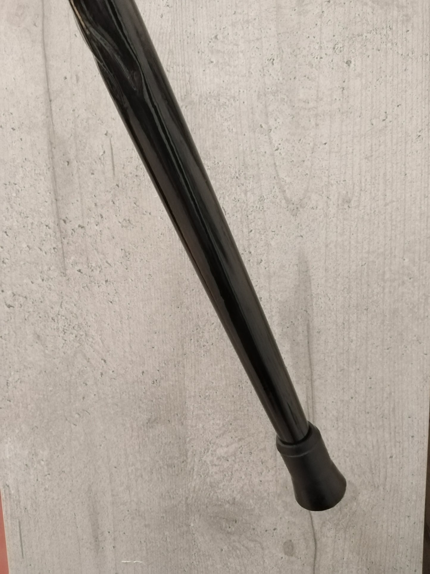 A carved wooden cane in the baroque style