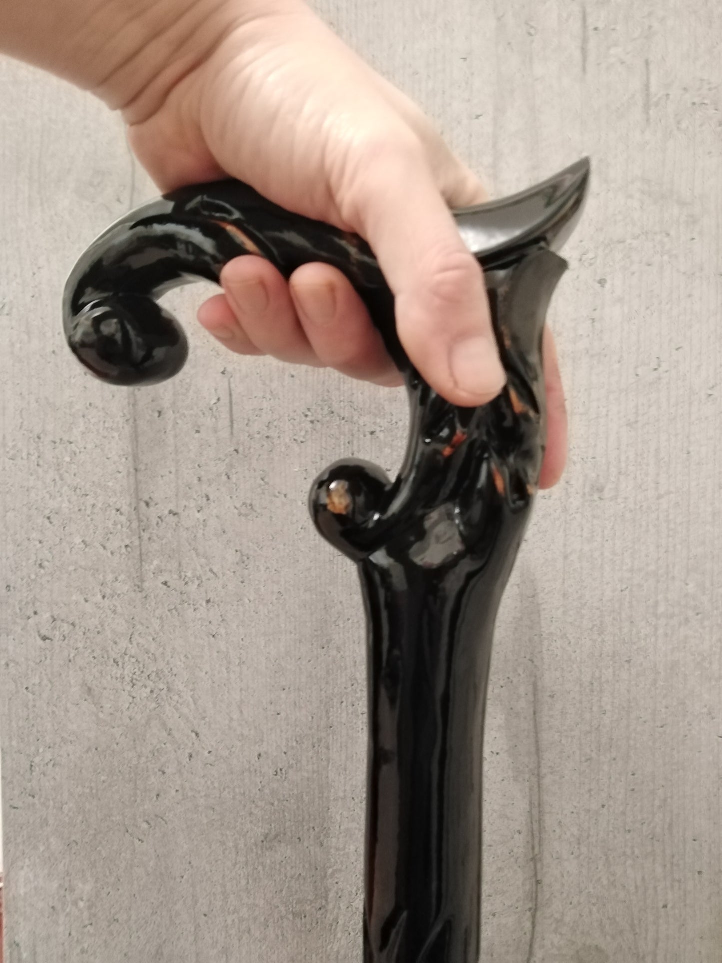 A carved wooden cane in the baroque style