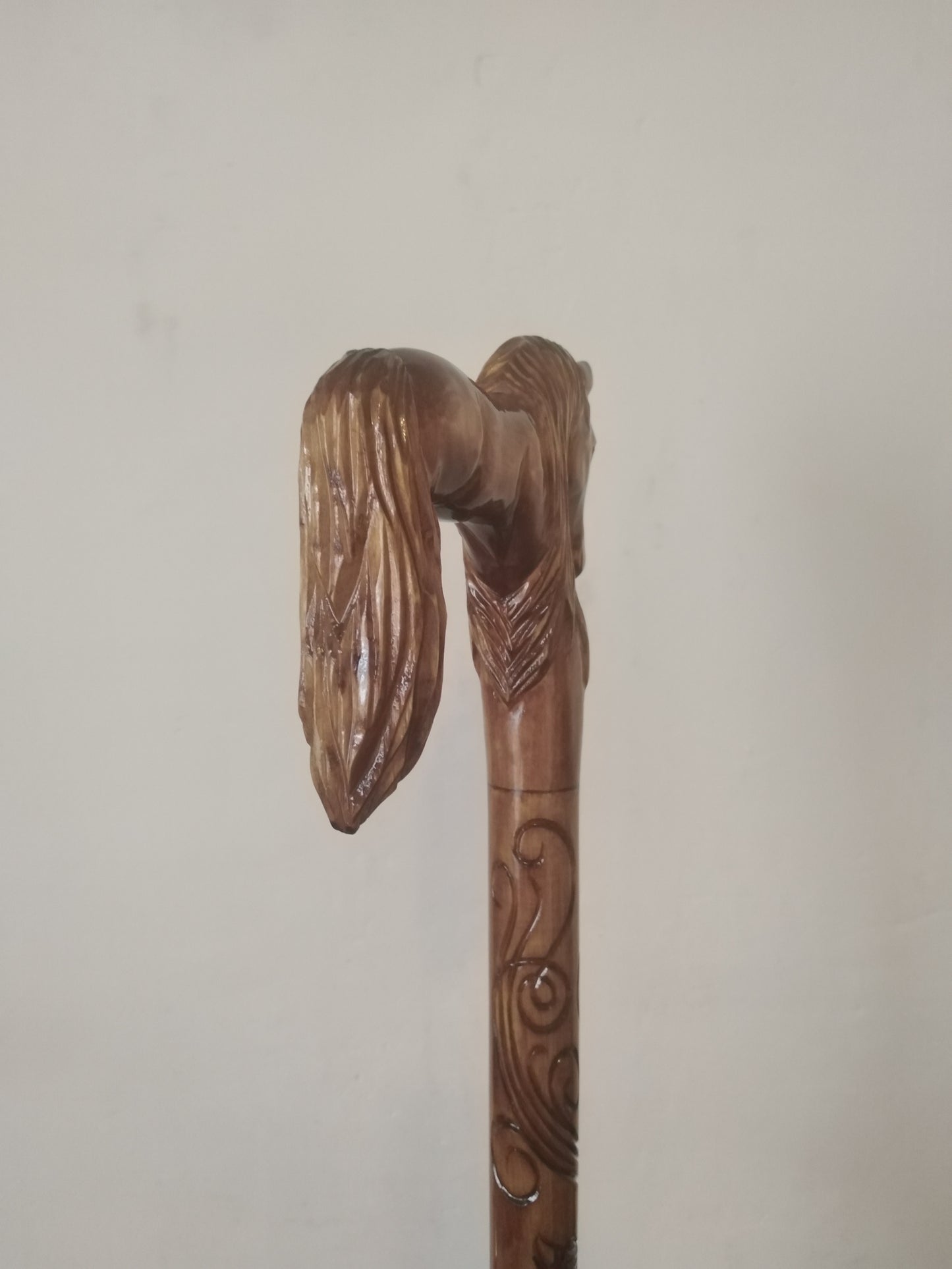 Carved wooden cane with a horse