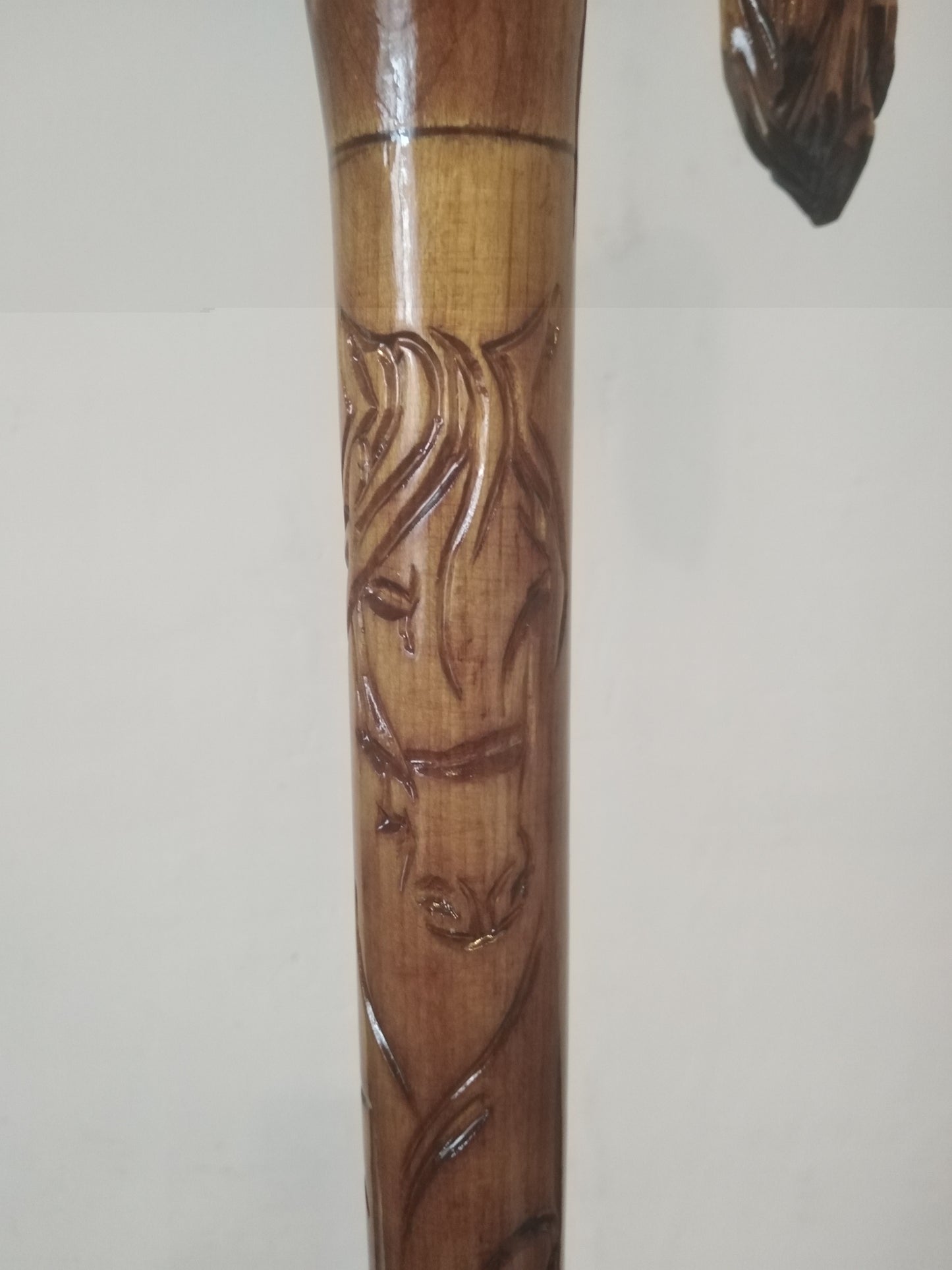 Carved wooden cane with a horse