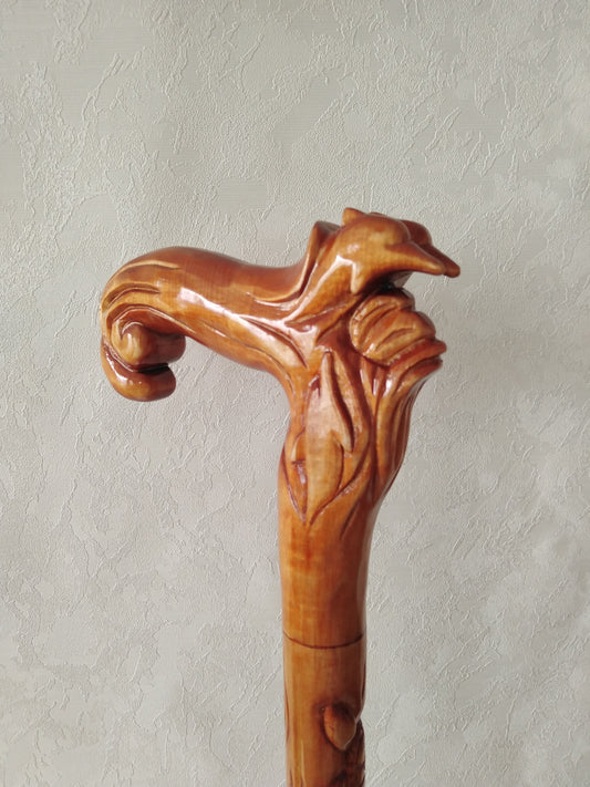 Carved wooden cane with dolphins