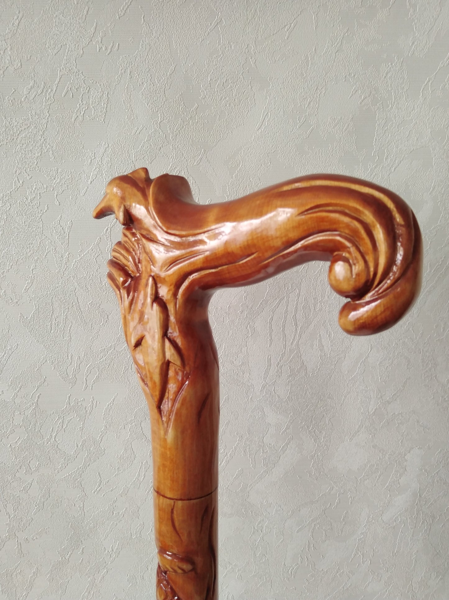 Carved wooden cane with dolphins