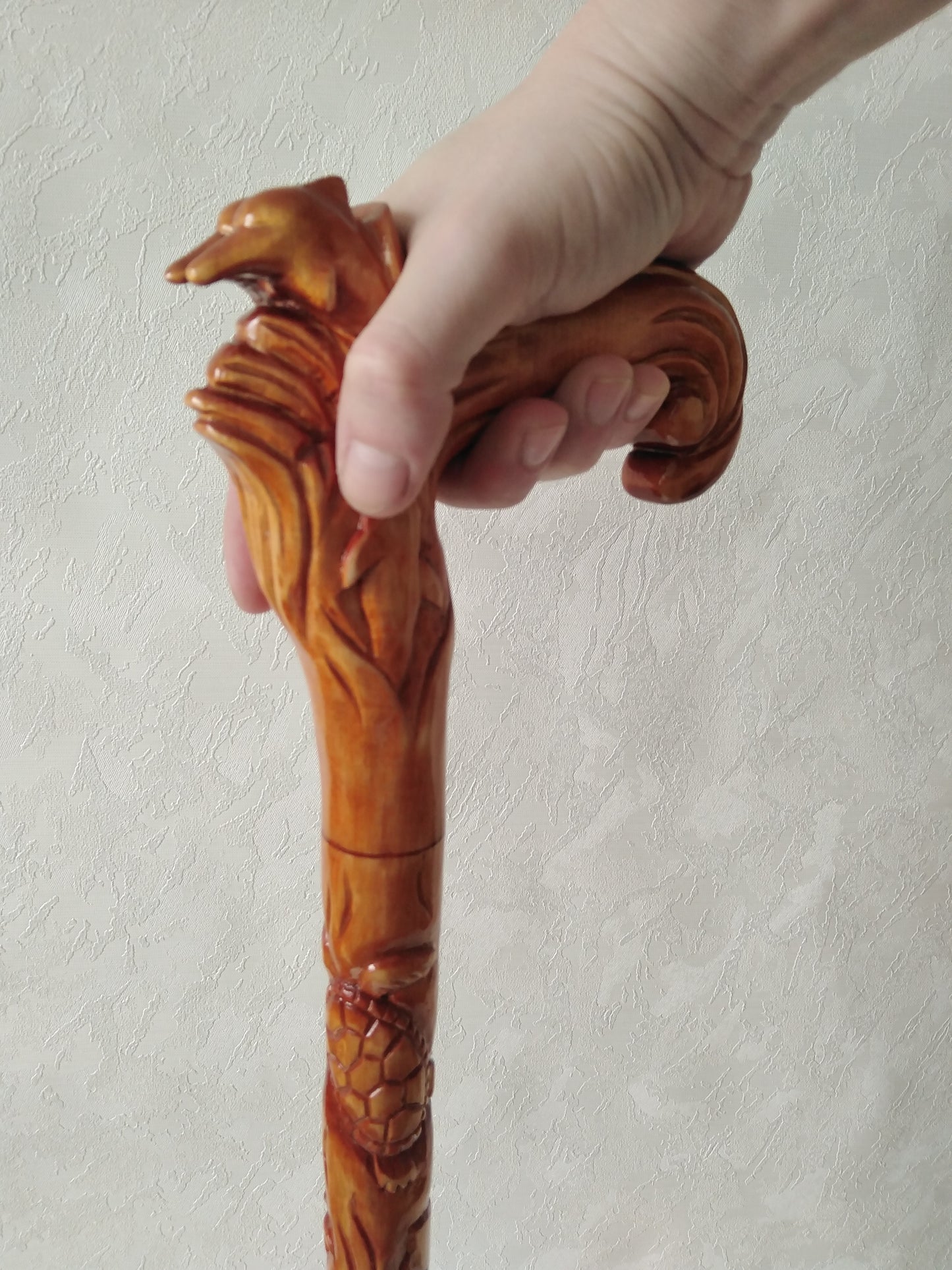 Carved wooden cane with dolphins