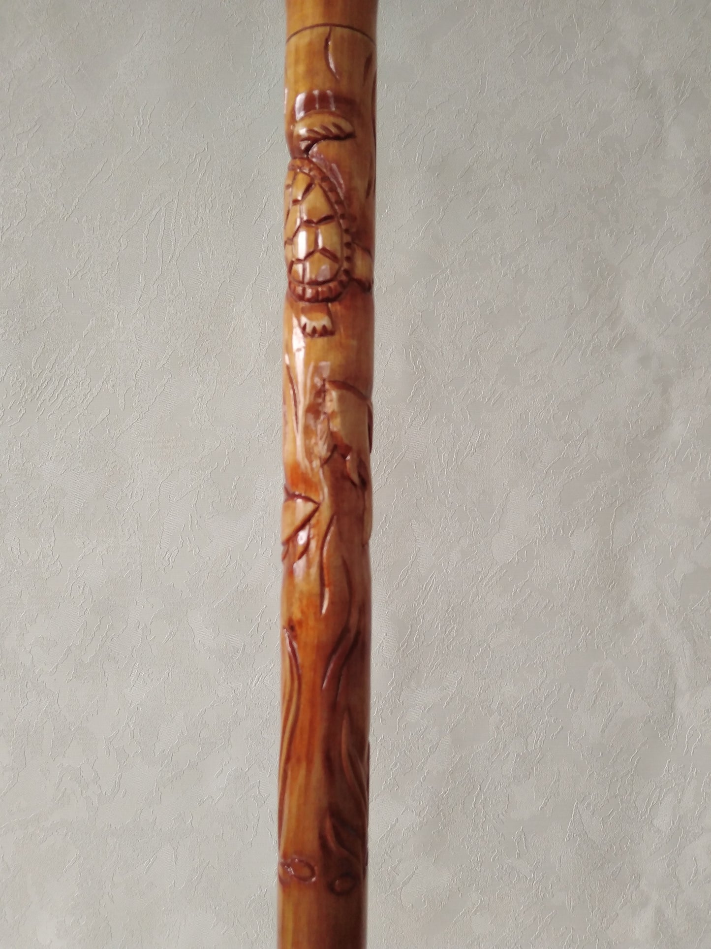 Carved wooden cane with dolphins