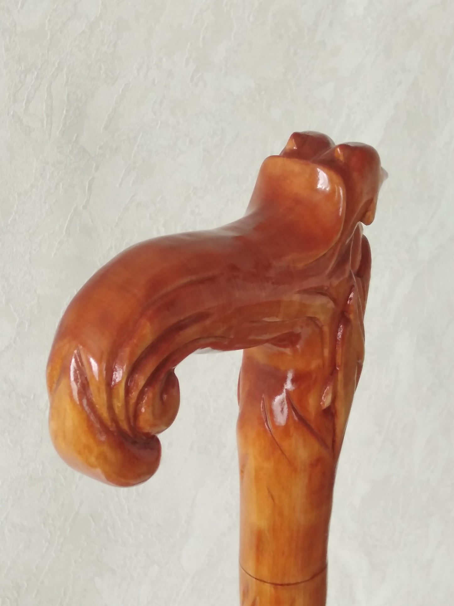 Carved wooden cane with dolphins