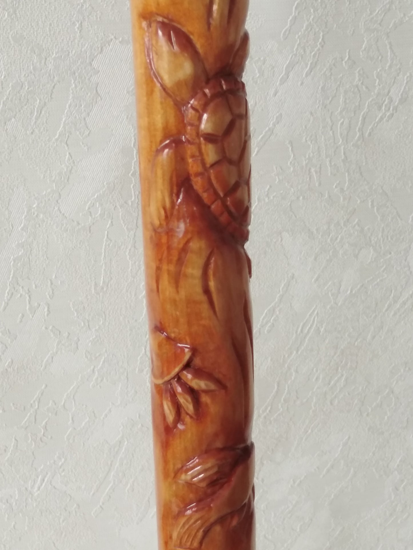 Carved wooden cane with dolphins