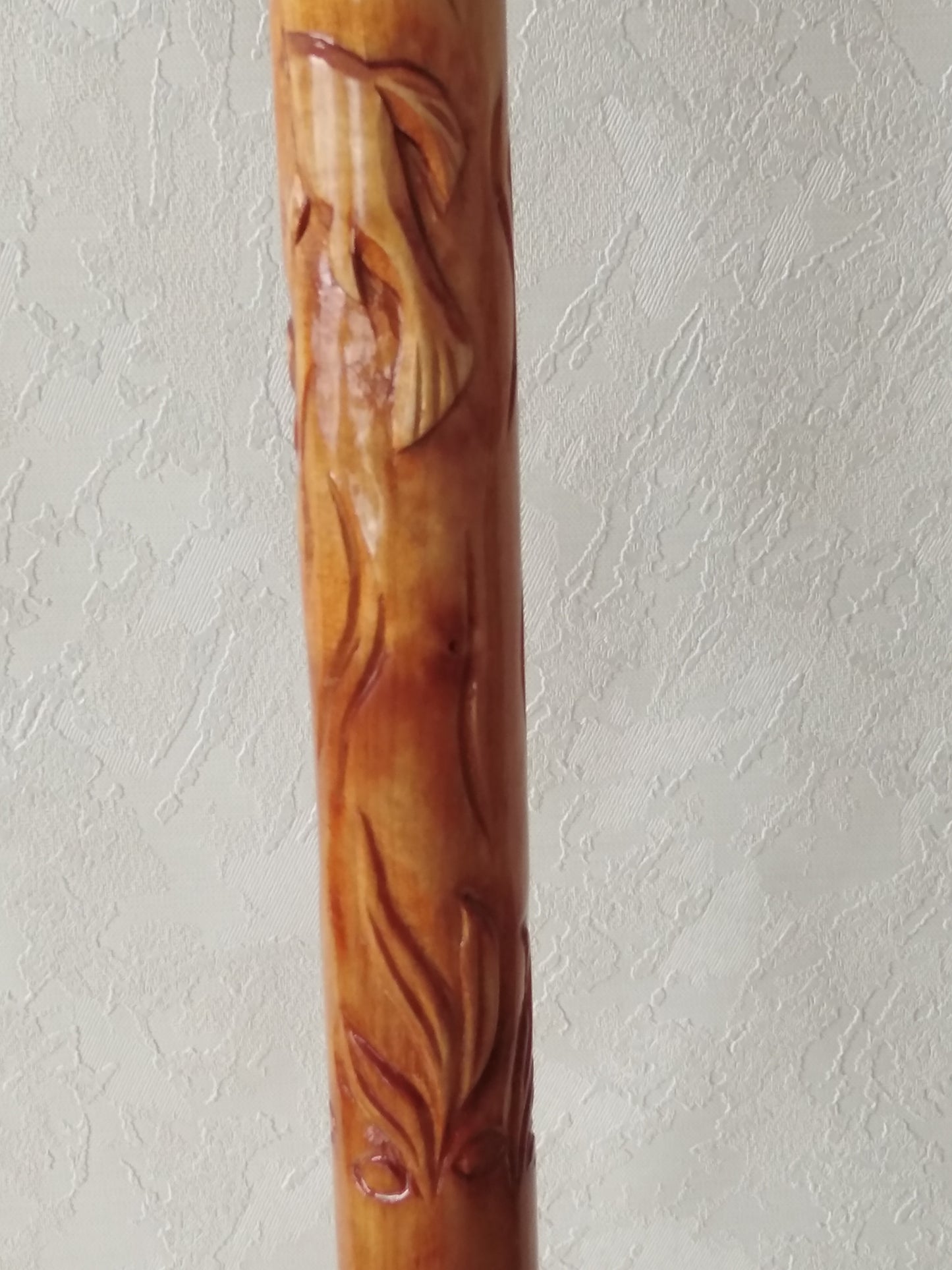 Carved wooden cane with dolphins