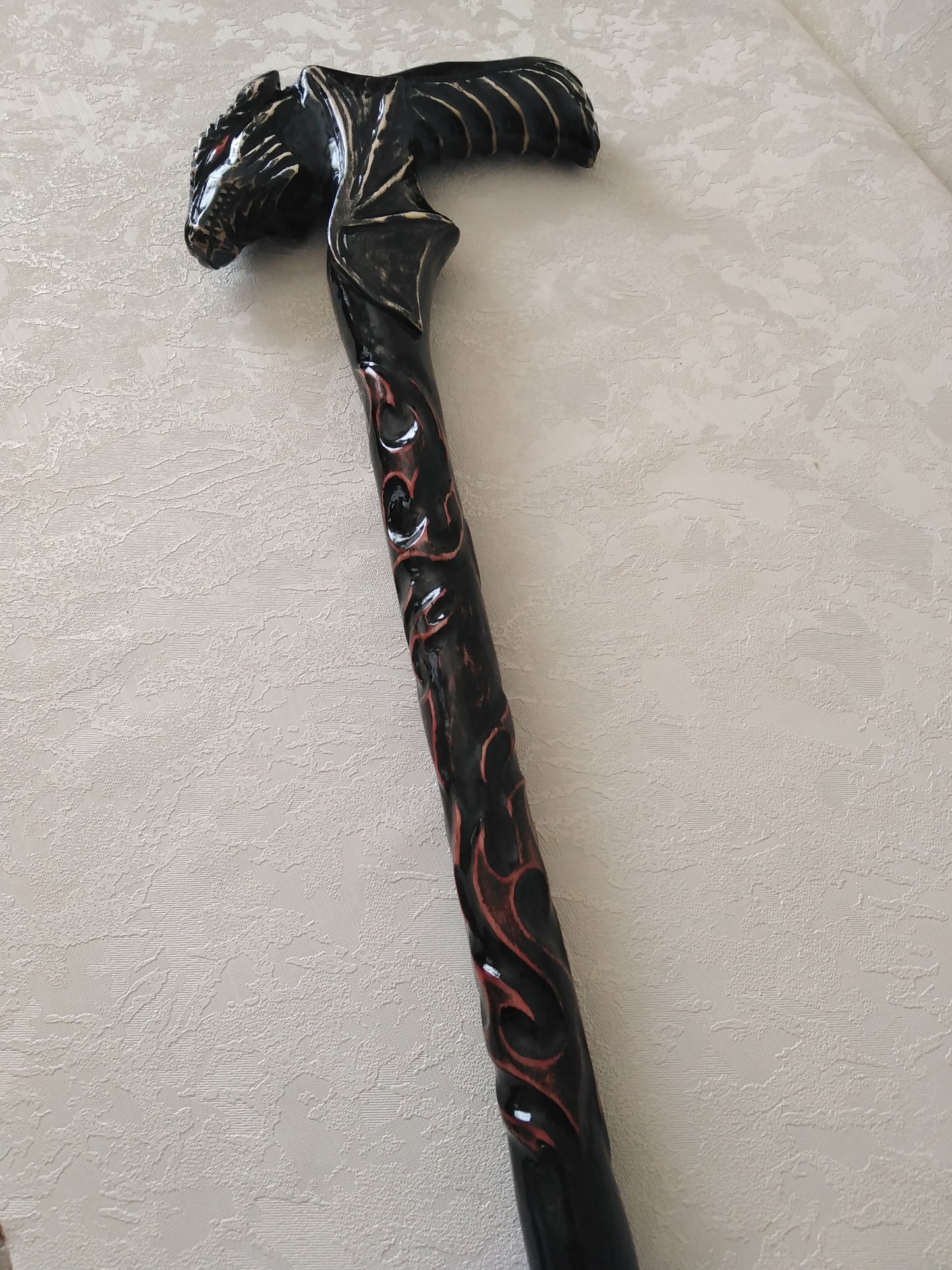 Carved wooden cane with dragon and flame