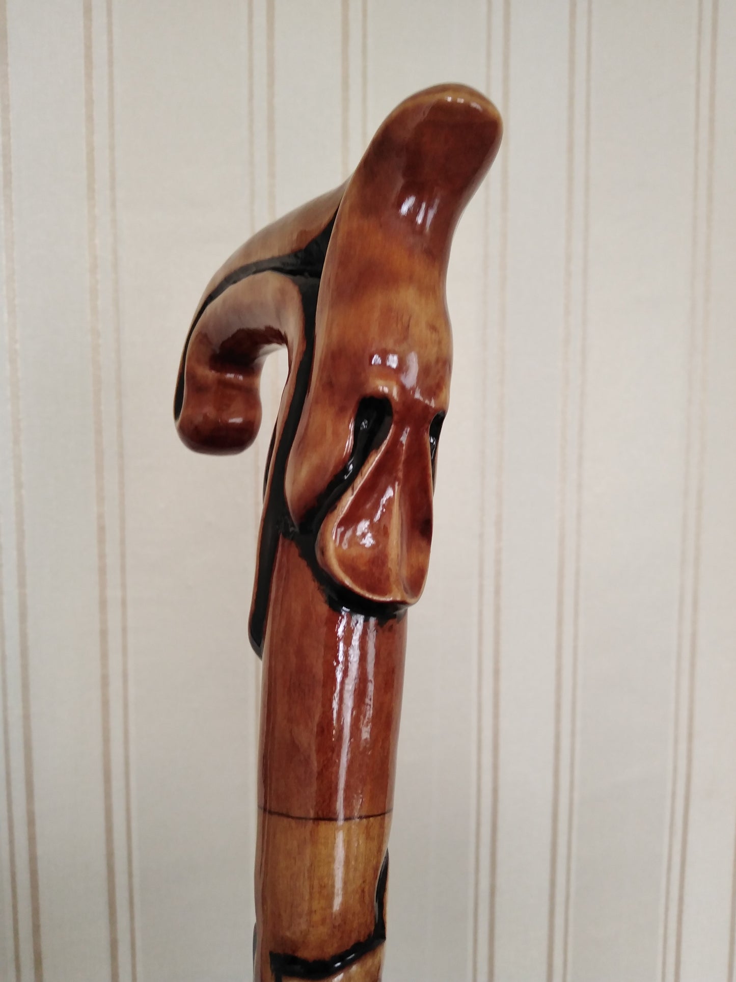 Carved wooden cane with leaf ornament