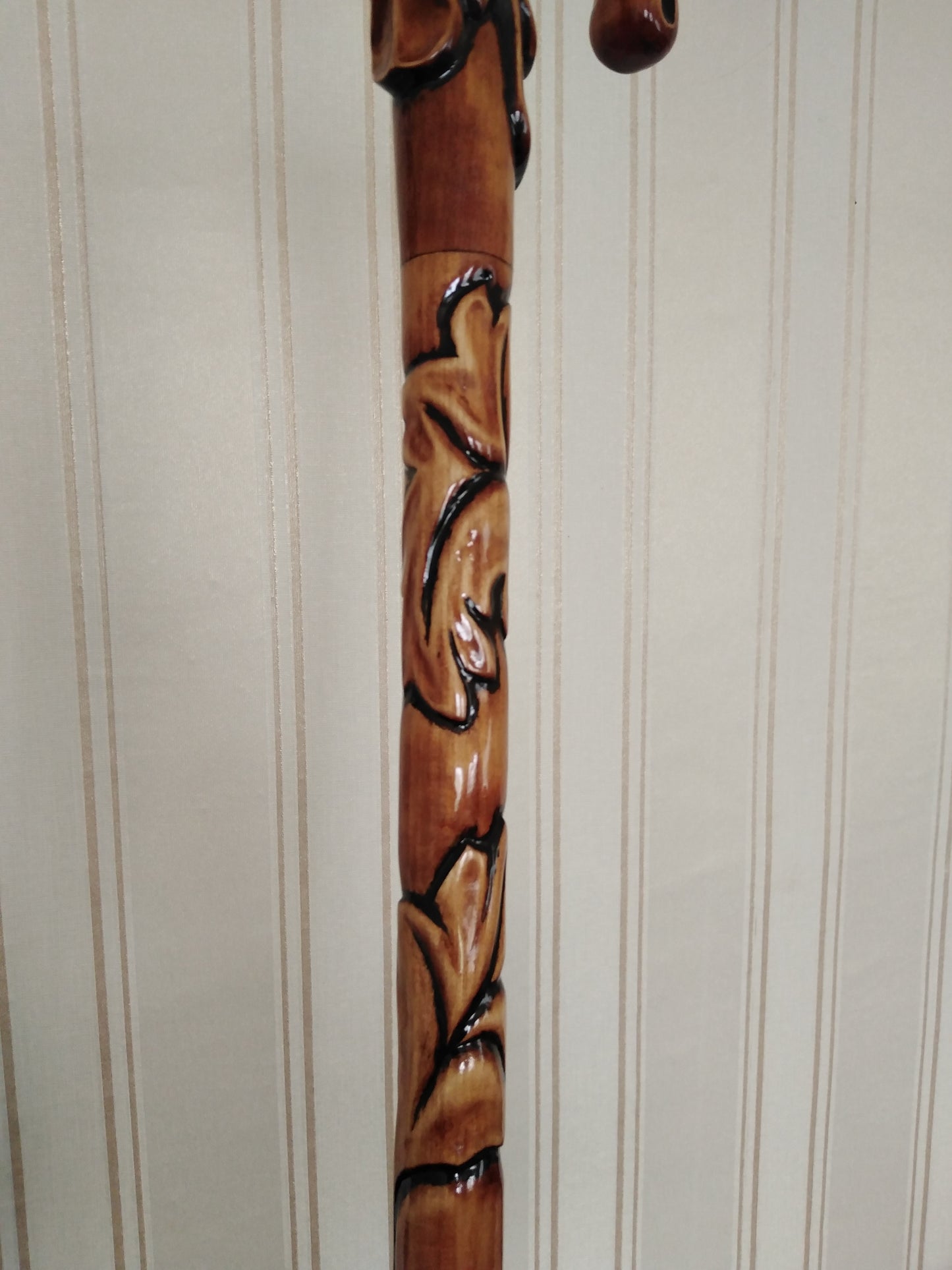 Carved wooden cane with leaf ornament