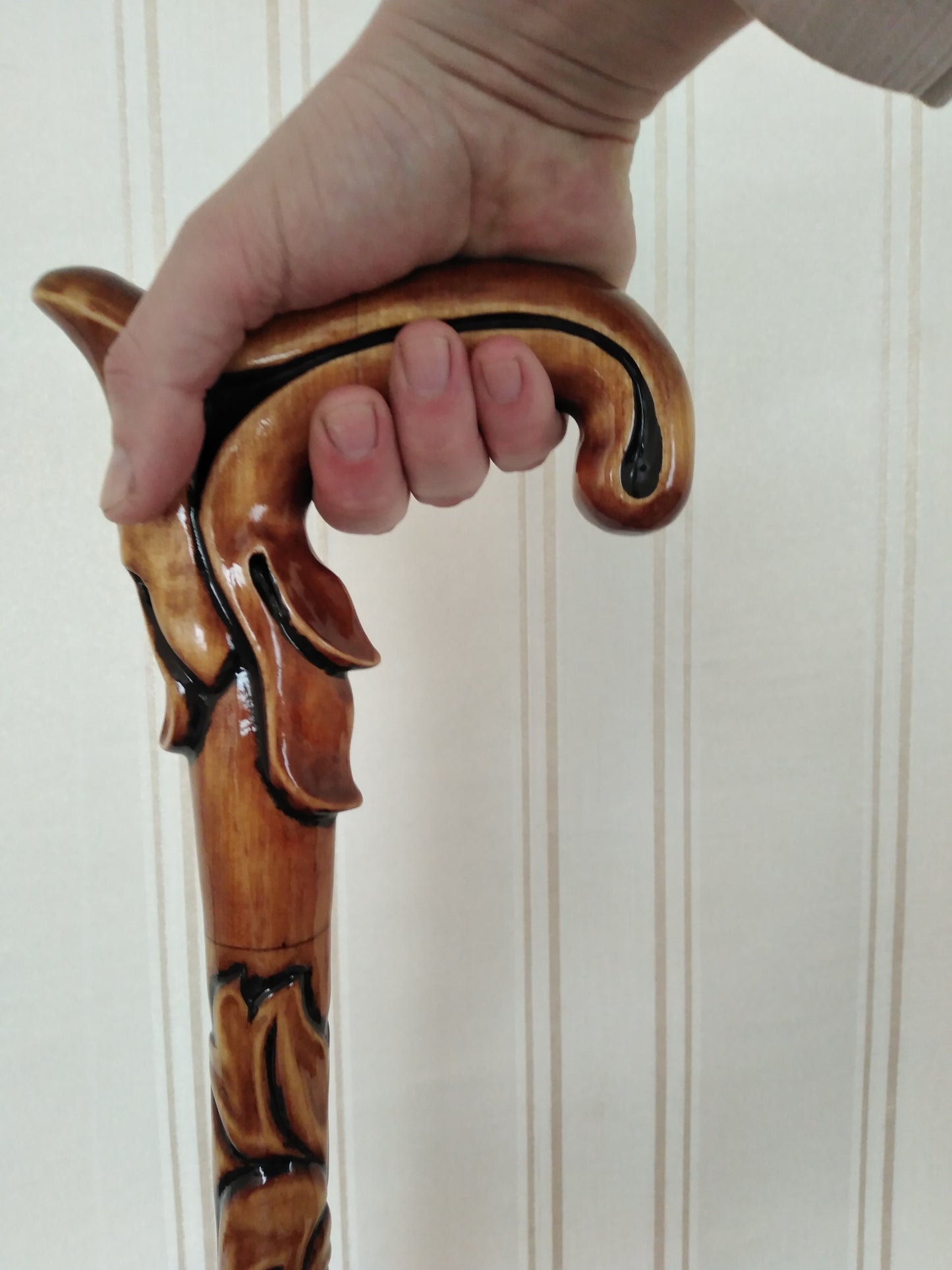 Carved wooden cane with leaf ornament