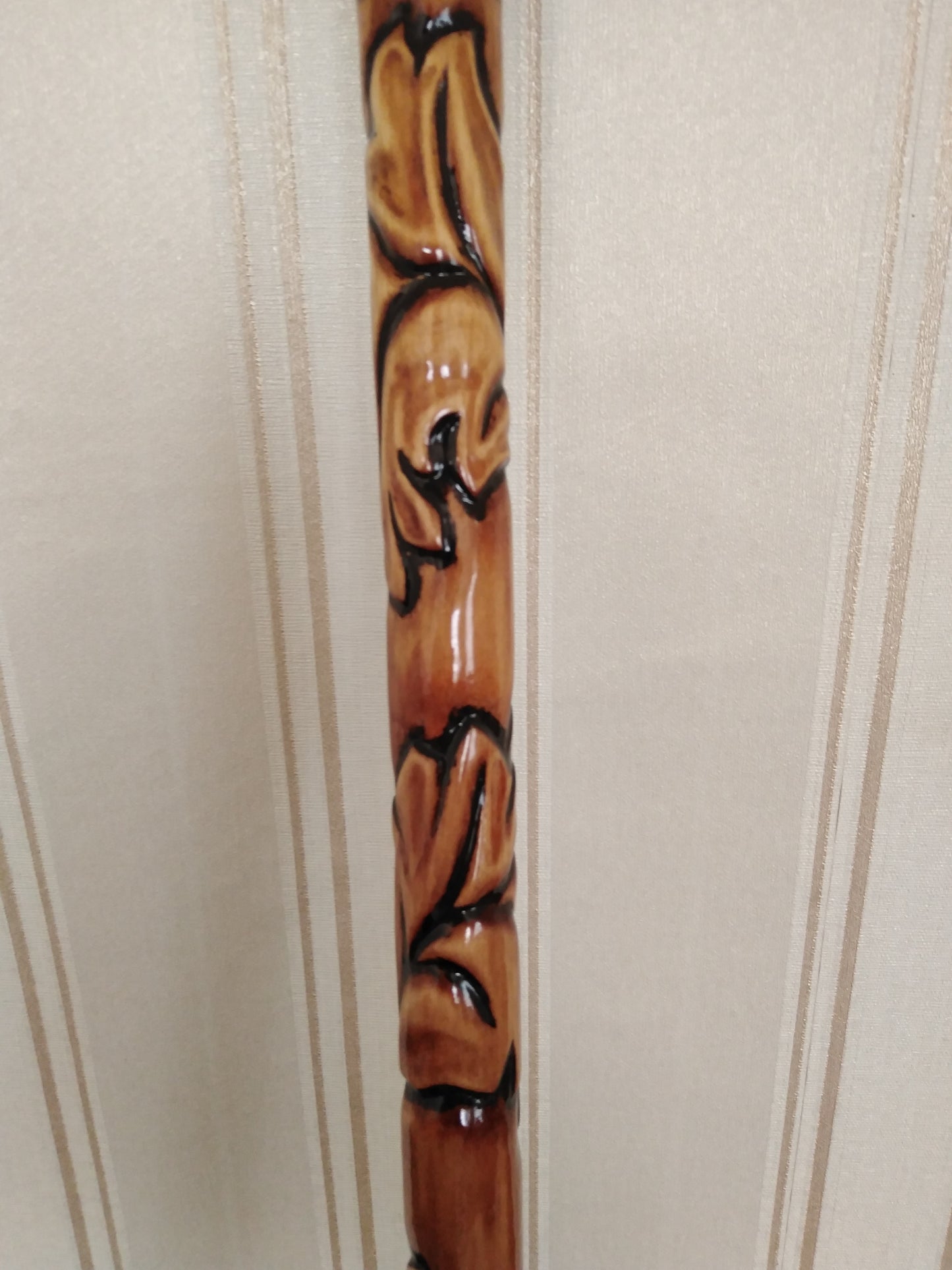 Carved wooden cane with leaf ornament