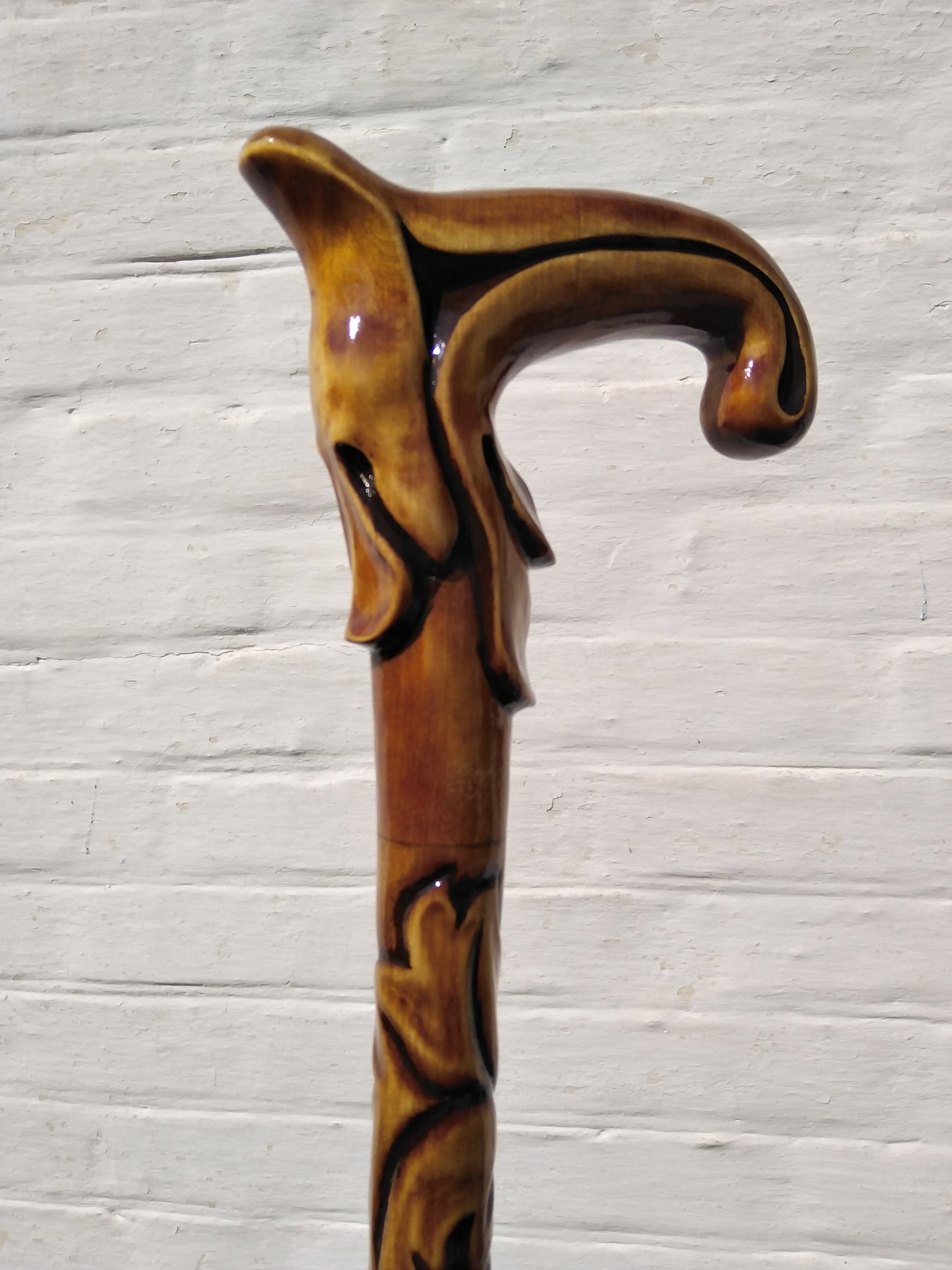 Carved wooden cane with leaf ornament