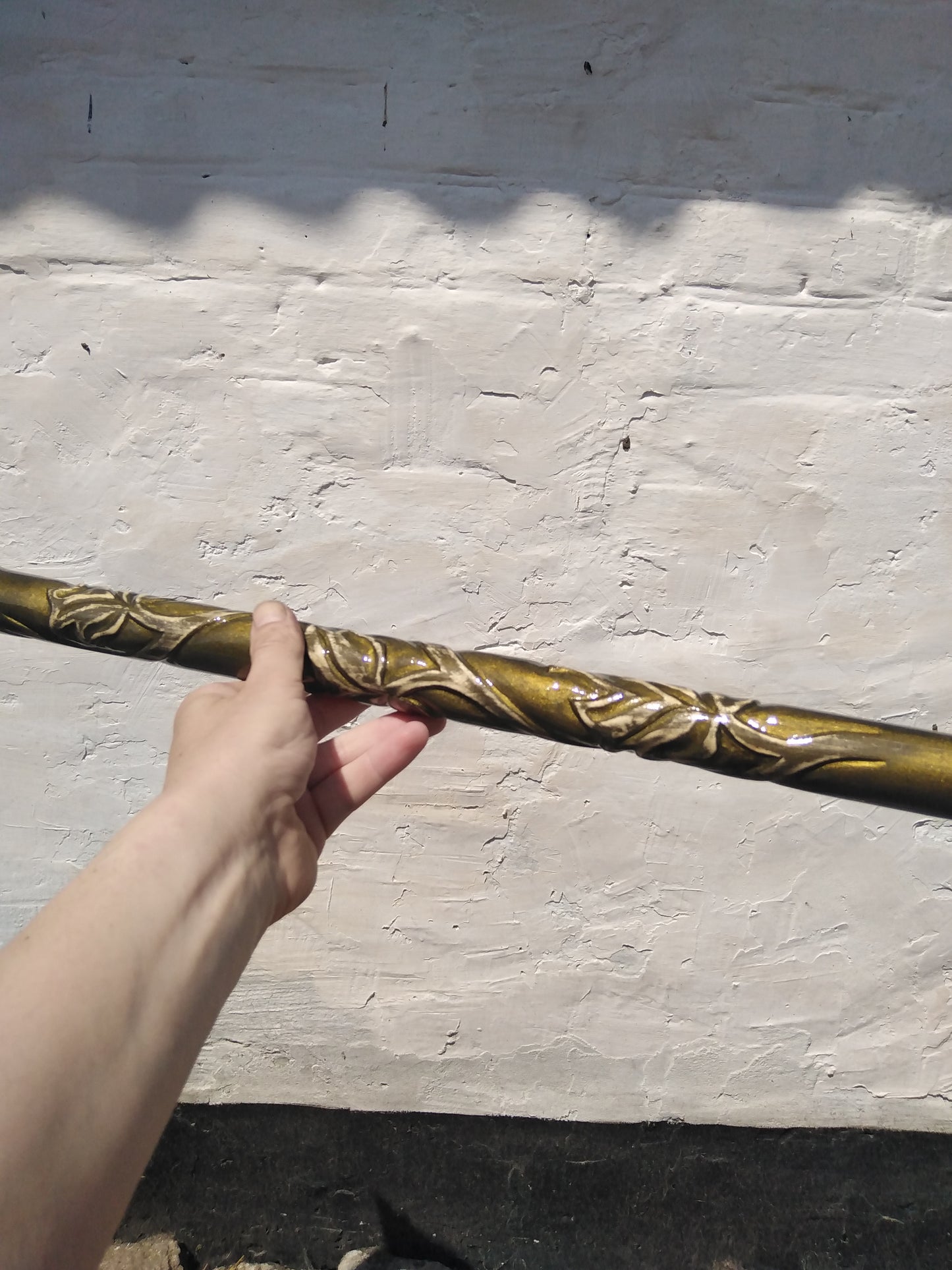 A carved wooden cane in the baroque style