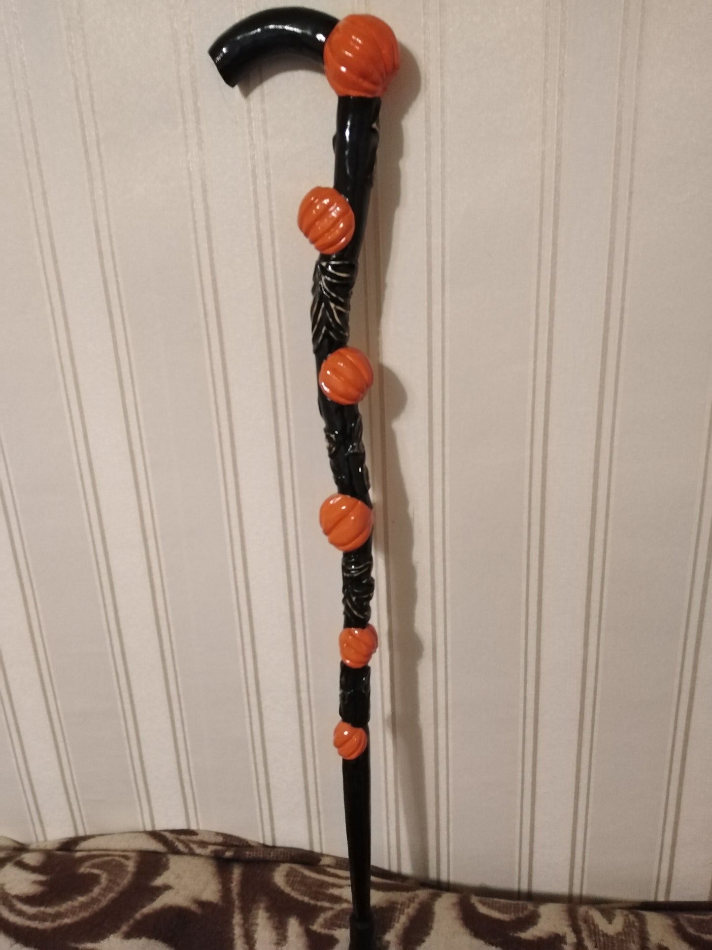 Carved wooden cane with pumpkins