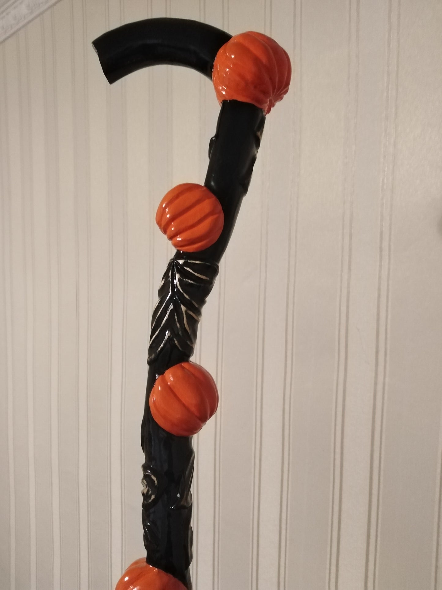 Carved wooden cane with pumpkins