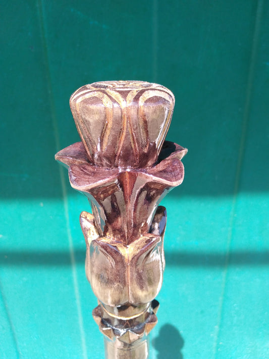 Carved wooden cane with a handle in the form of a flower