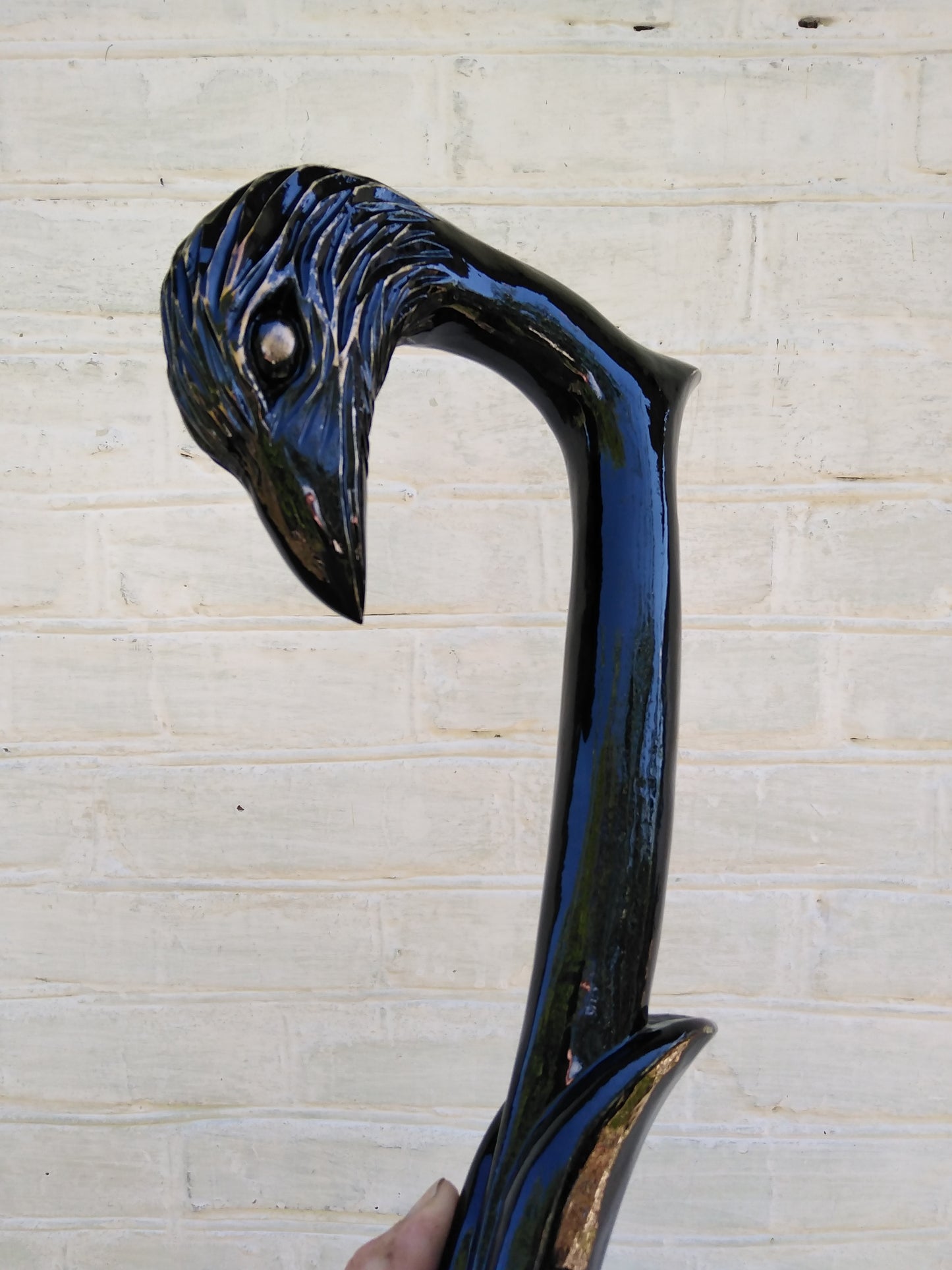 Carved wooden cane with a crow