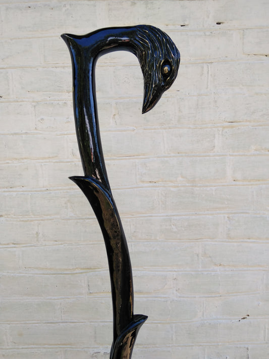 Carved wooden cane with a crow