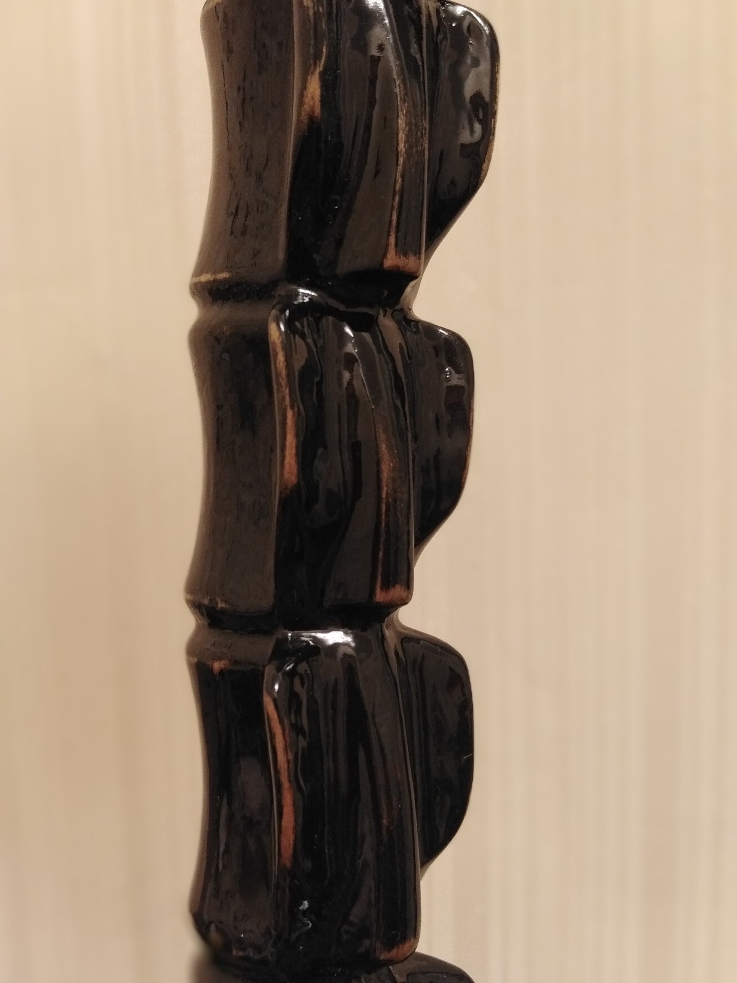 Carved wooden cane in the form of a spine with a crow's skull