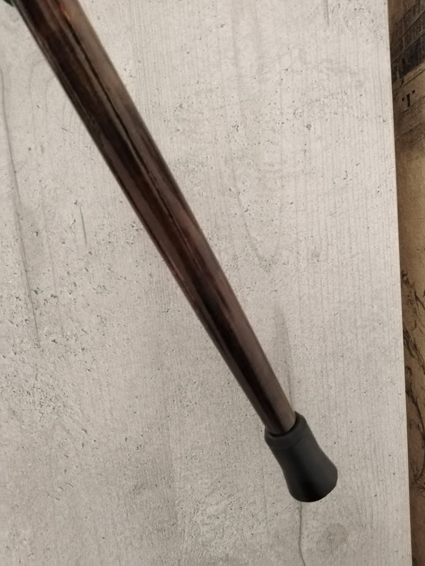 Carved wooden cane with geocinthes